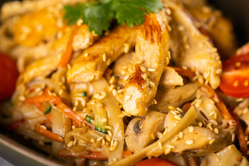 Udon stir-fry noodles with chicken and vegetables. Asian cuisine