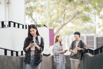 people, knowledge, education, literature and university concept - happy students reading books and preparing to exams university.