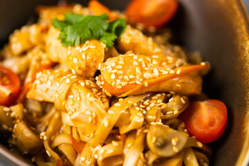 Udon stir-fry noodles with fish and vegetables. Asian cuisine
