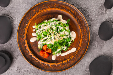 Traditional Japanese wakame salad with sesame seeds - asian food. Healthy and fresh seaweed salad top view