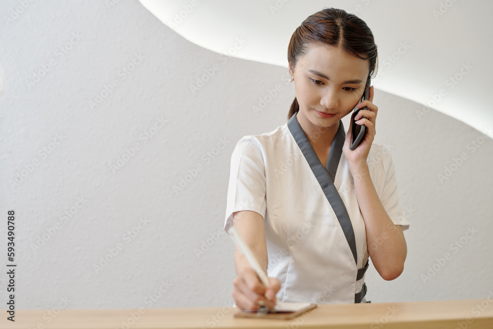 Sticker beauty salon receptionist talking on phone with client and checking schedule