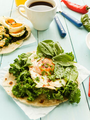 Pitas with eggs and greens