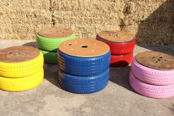 Recycled wheels are chairs for relaxing.