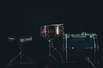 Fototapeta na wymiar Drum kit on a black background close-up.