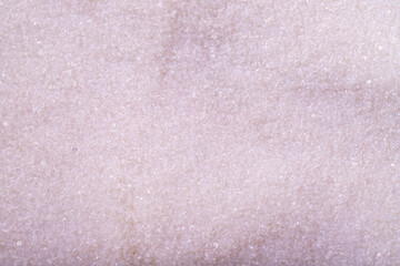 White granulated sugar. White refined sugar texture background. Top view