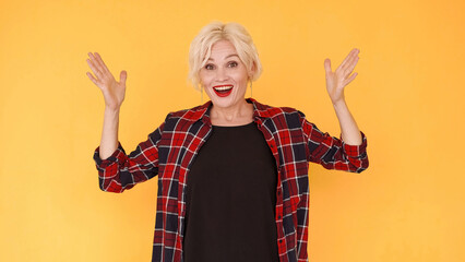 Unexpected surprise. Excited woman. Playful mood. Expressive middle-aged lady showing hands up...
