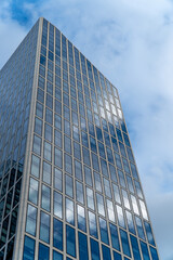 Fototapeta premium Reflective Skyscraper in the financial district of Franfurt in Germany.