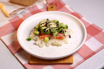 Sushi waffles are crispy rice cooked in a waffle iron with salmon. Trending food, hybrid food