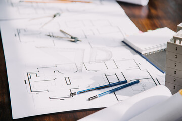 Two business man construction site engineer. Engineering objects on workplace with partners interacting on background