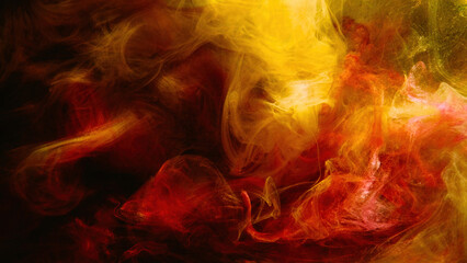 Color smoke. Paint water mix. Fire flame. Red yellow burning glowing glitter vapor texture on dark...