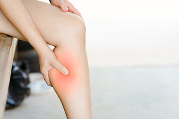 Women have pain in their legs or calves due to cramps. Concept of health problems. - obrazy, fototapety, plakaty