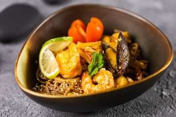 Udon stir-fry noodles with mussels and shrimp. Asian cuisine