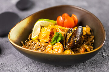 Udon stir-fry noodles with mussels and shrimp. Asian cuisine