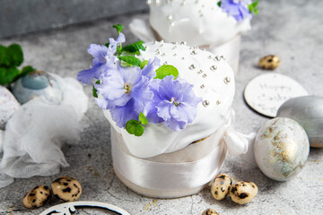 Easter cupcake with Swiss meringue and fresh flowers.Easter eggs