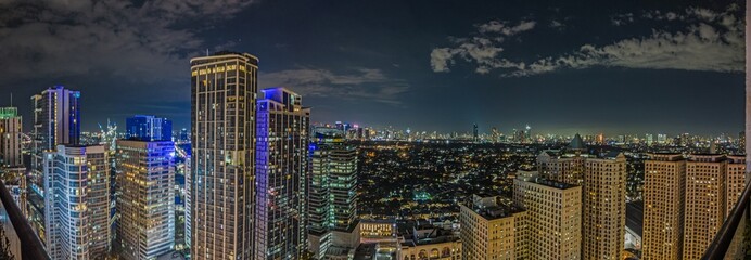 Panoramic image over Manila skyline at night