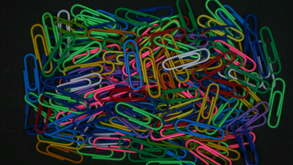 Paper clip isolated on a black background