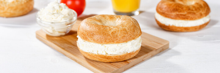 Bagel sandwich with cream cheese for breakfast panorama