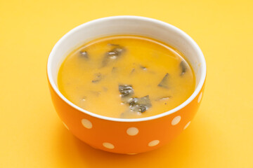 Vegetable cream soup with spinach in bowl