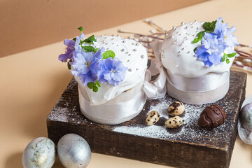 Fototapeta na wymiar Easter cake with Swiss meringue and fresh flowers.Easter eggs