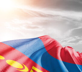 Mongolia national flag cloth fabric waving on beautiful sky grey Background.