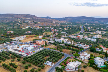 Obraz premium Crete, Greece - olive groves and city aerial view, landscape aerial photography, hills and mountains in the background