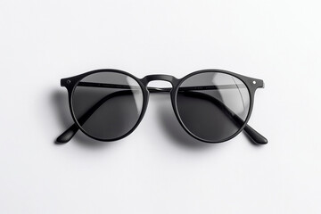 Pair of black sunglasses on a white background