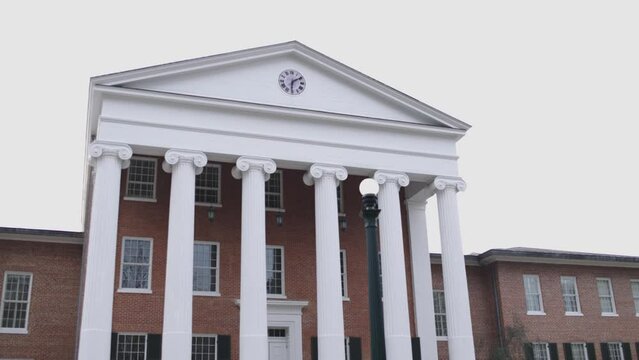 Institute for Data Science building with flowers on the campus of Ole Miss in Oxford, Mississippi with video tilting up at an angle.
