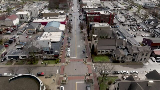 Downtown Bloomington, Indiana with drone video tilting up.
