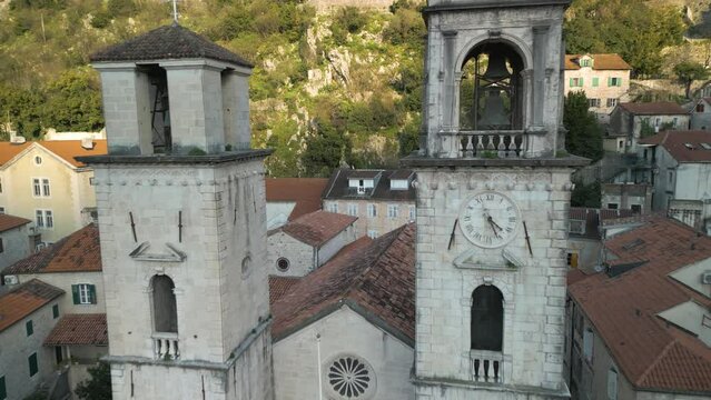 Backwards drone dolley shot between the church towers of the St Tryphon cathedral in Kotor.