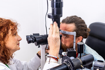 Woman ophthalmologist conducting an eye examination