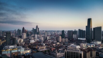 Fototapeta na wymiar Aerial shot of a modern cityscape under the cloudy sunset