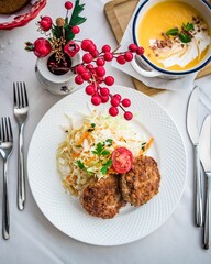 Overhead shot of rissoles and salad on a plate