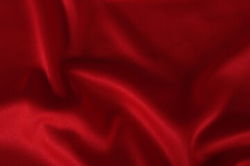 Polyester fabric background in red color wave style.