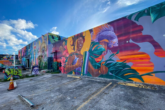 Miami, Florida, USA - November 2, 2022: Colorful graffiti art line the street walls of Wynwood neighborhood in Miami, Florida, USA