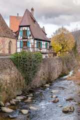 Fototapeta na wymiar Kaysersberg; Alsace, France - December 7, 2022: Medieval houses by the river