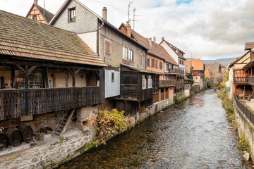 Fototapeta na wymiar Kaysersberg; Alsace, France - December 7, 2022: Traditional houses by the river