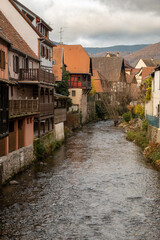 Kaysersberg; Alsace, France - December 7, 2022: Traditional houses by the river