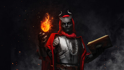 Portrait of evil sorcerer with fireball dressed in red robe and horned mask.