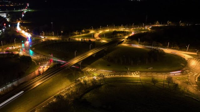 Aerial Night Hyperlapse Motion Time-Lapse of A47 Major Road and Roundabout with Car Light Trails in King's Lynn Norfolk UK
