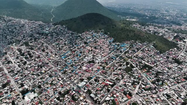 Aerial view of houses colored to form Dr Simi face in Favela, Ecatepec, Mexico