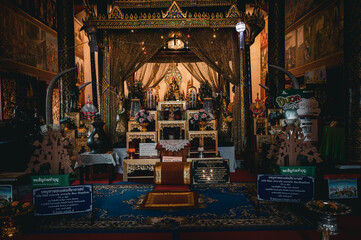 Uttaradit, March 25 2023. Wat Phra Thaen Sila At, t holds the base of a rectangular sermon platform built with laterite, patterned with sacred lotus petals. Interior of the church.