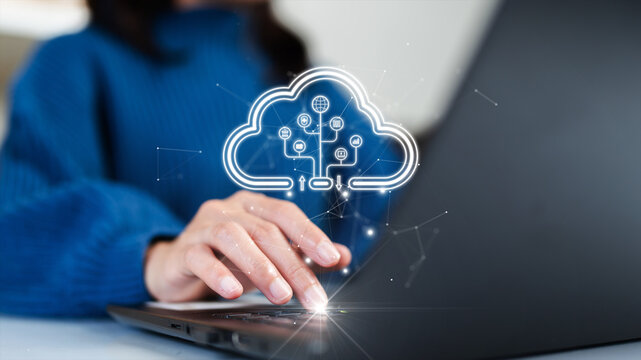 Woman uploading and transferring data from computer to cloud computing. Digital technology concept, data sheet management with large database capacity and high security.