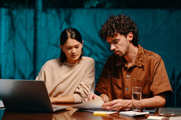 Business colleagues working with documents when creating business plan