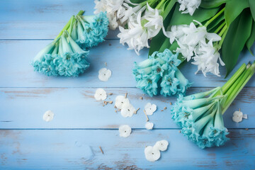 Blue hyacinths against a blue wooden background