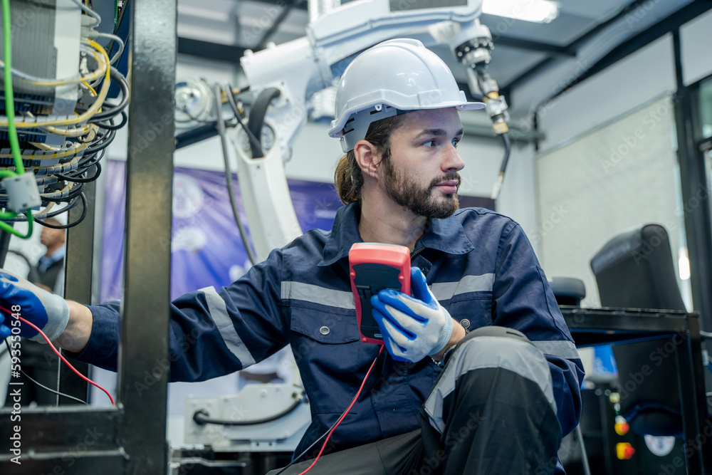 Fototapete technical engineer using measuring equipment to checking electrical current voltage.