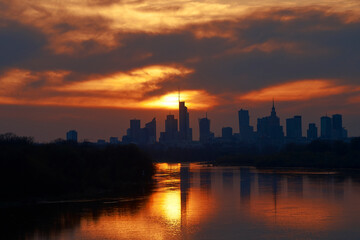 Fototapeta na wymiar Sunset over the center of Warsaw in spring, view from the Vistula River