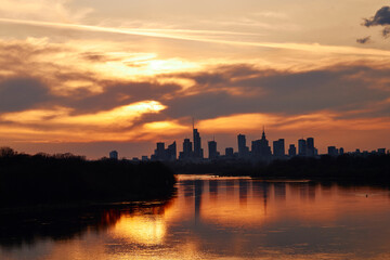 Fototapeta na wymiar Sunset over the center of Warsaw in spring, view from the Vistula River