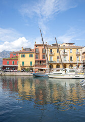 View of the lake and boats in the town of Malcesine Garda Italy 