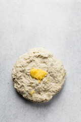 Loosely folded bread dough with butter in the middle, bread dough, low hydration dough, process of making bread