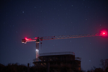construction crane at night against the starry sky